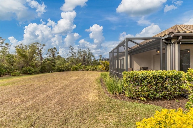 view of yard with a lanai