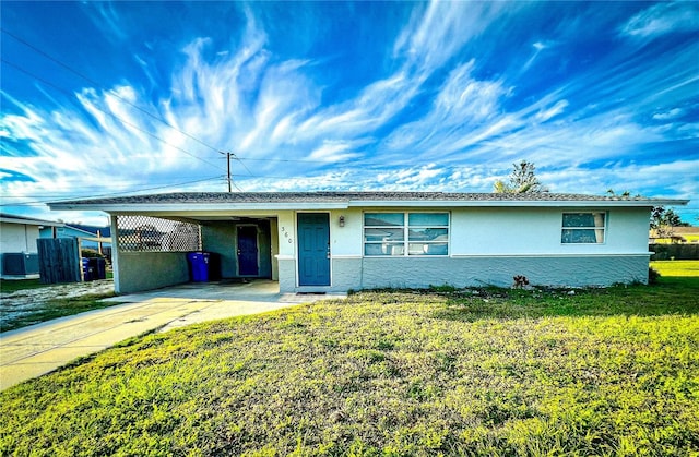 ranch-style house with a front lawn and a carport