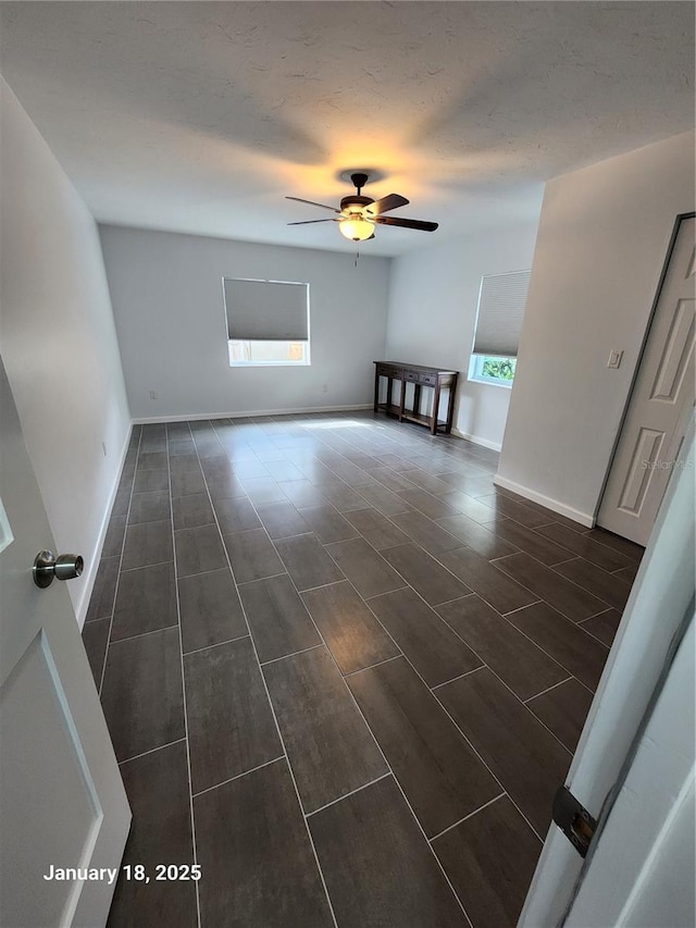 interior space featuring ceiling fan