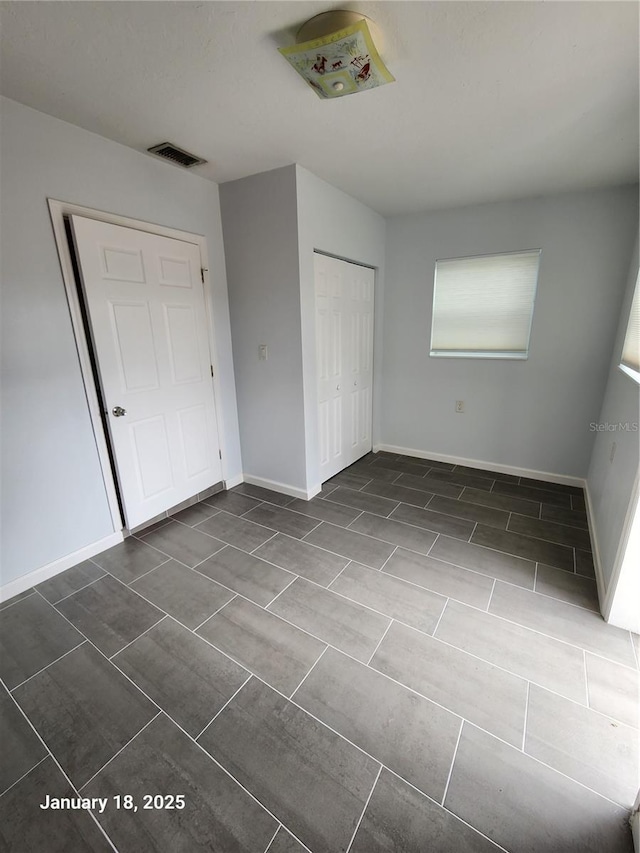 unfurnished bedroom featuring a closet