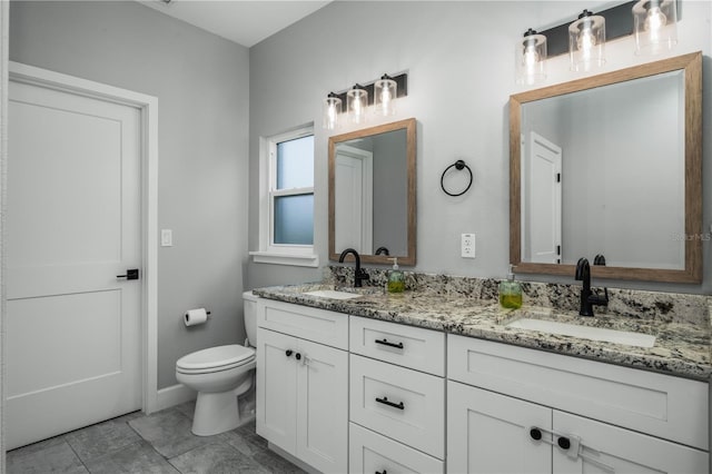 bathroom featuring tile patterned floors, toilet, and vanity