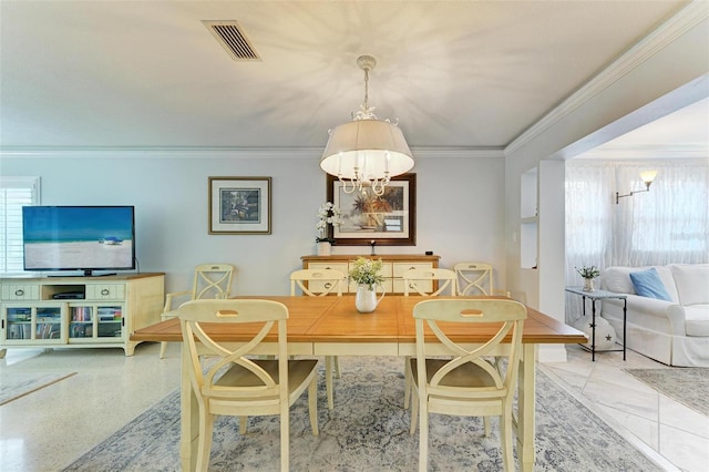 dining area featuring a notable chandelier and ornamental molding