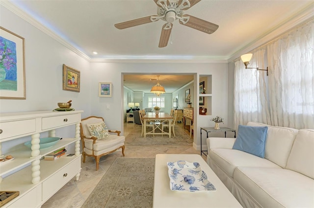 living room featuring ceiling fan, ornamental molding, and plenty of natural light