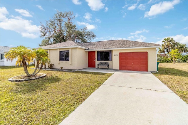 ranch-style house with a front lawn and a garage