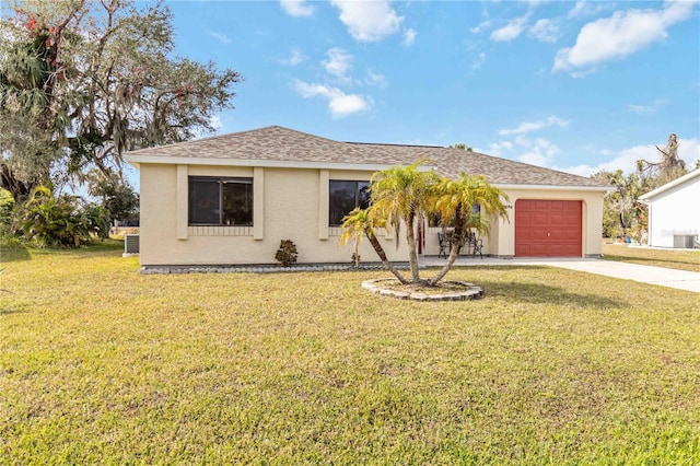 view of front of property with a front lawn and a garage