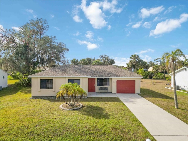 ranch-style house featuring a garage and a front yard