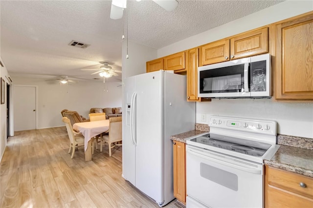 kitchen with a textured ceiling, ceiling fan, light hardwood / wood-style floors, and white appliances