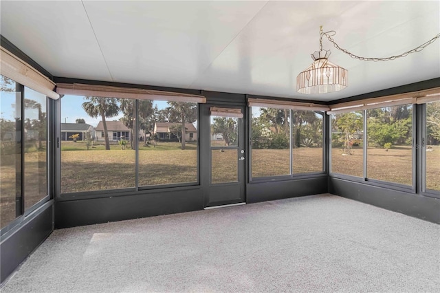 unfurnished sunroom with plenty of natural light