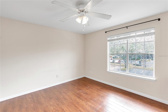 empty room featuring ceiling fan and hardwood / wood-style flooring