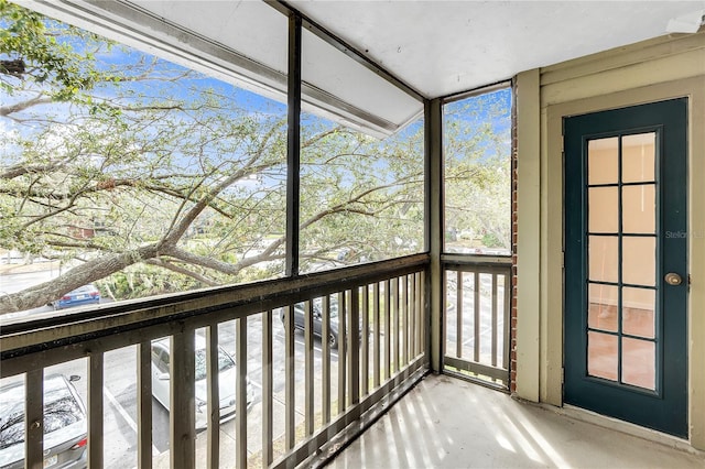 unfurnished sunroom featuring a wealth of natural light