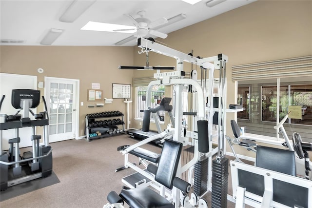 workout area with ceiling fan, carpet floors, and lofted ceiling