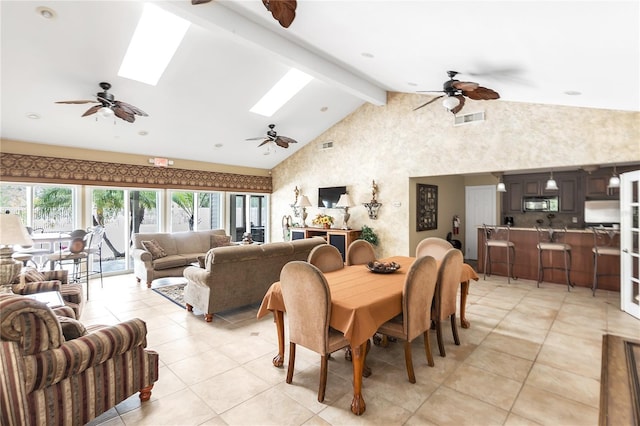 tiled dining room featuring a skylight, beam ceiling, and high vaulted ceiling