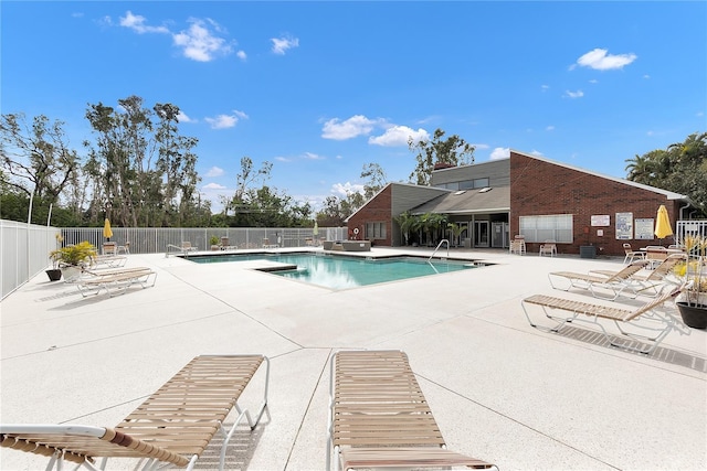 view of swimming pool with a patio