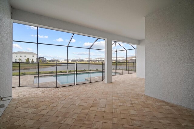 pool featuring a residential view, a patio area, and a lanai