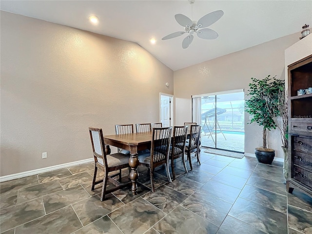 dining area with ceiling fan and high vaulted ceiling