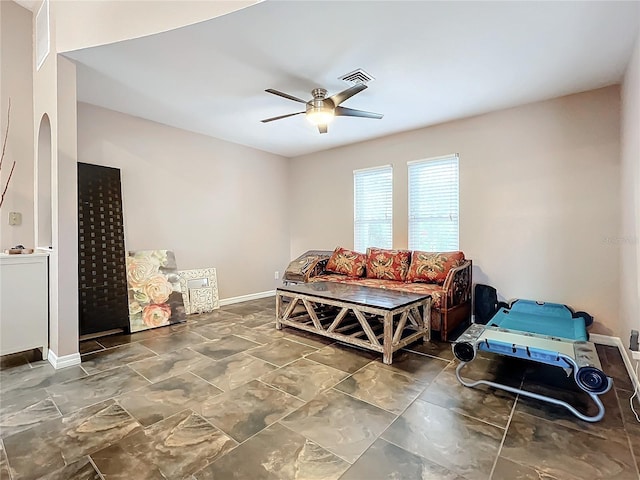 living area with ceiling fan