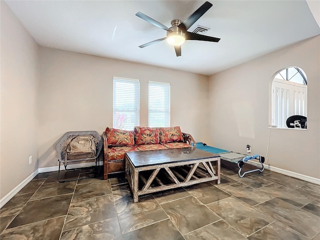 sitting room featuring ceiling fan