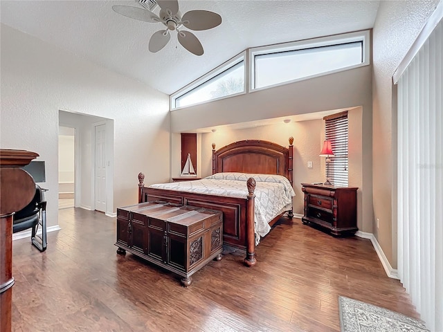 bedroom with dark wood-type flooring, ceiling fan, lofted ceiling, and a textured ceiling