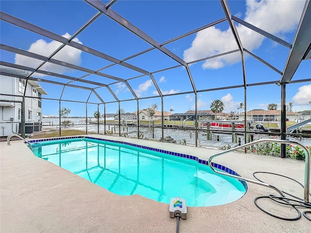 view of swimming pool featuring a lanai, a dock, a water view, and a patio