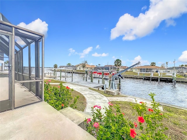 view of dock featuring a lanai and a water view