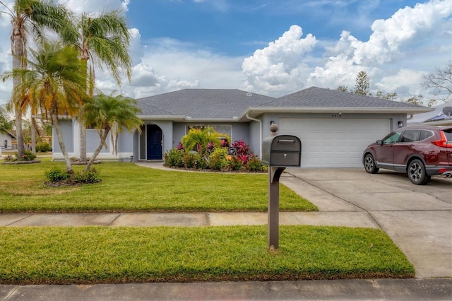 ranch-style house featuring a front yard and a garage