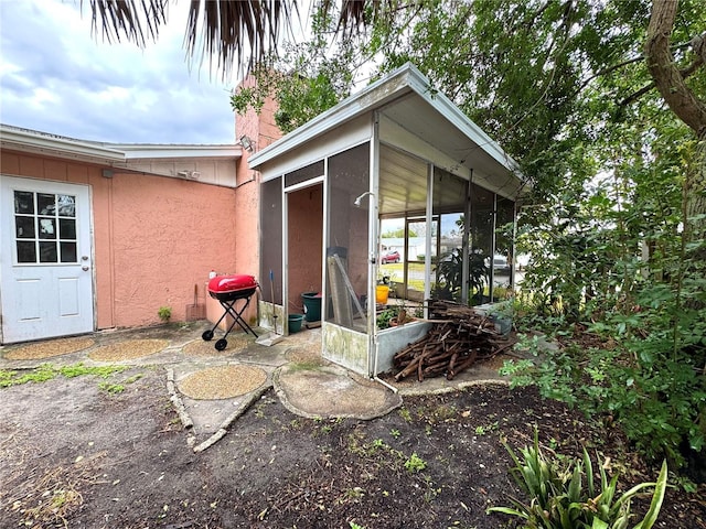 exterior space featuring a sunroom