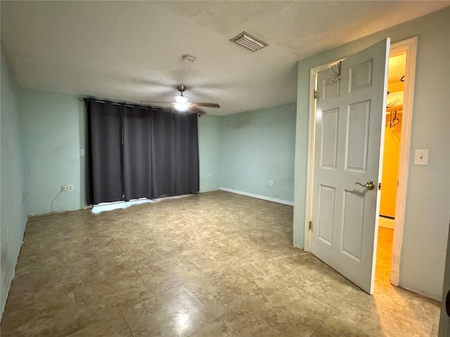 spare room with ceiling fan