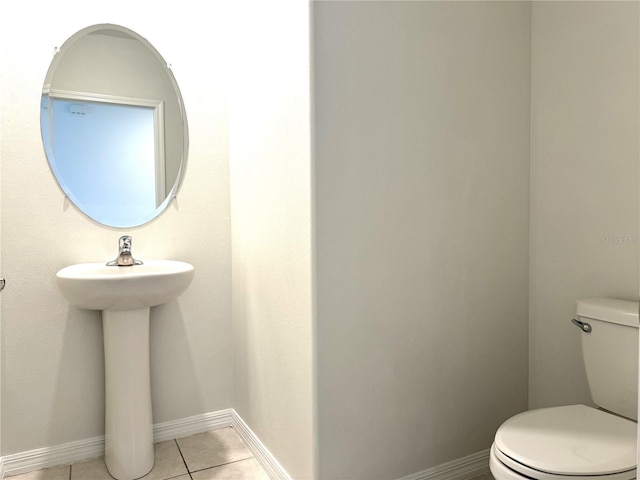 bathroom featuring toilet and tile patterned floors