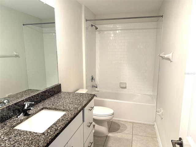 full bathroom featuring toilet, vanity, tile patterned floors, and tiled shower / bath