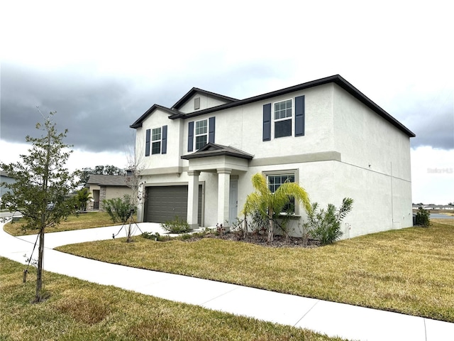 view of front facade featuring a garage and a front yard