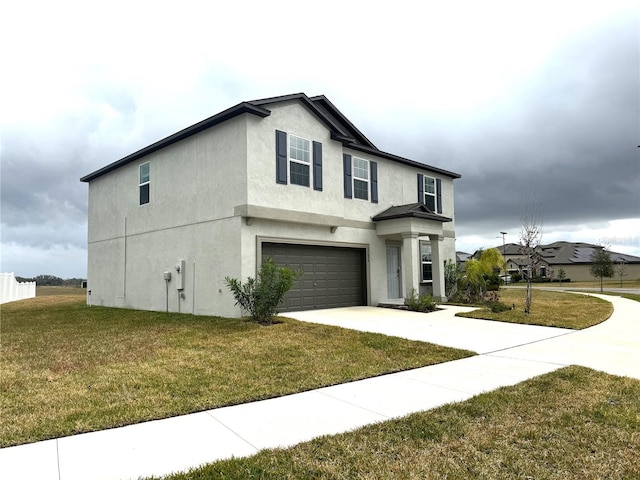 view of front facade with a front lawn and a garage