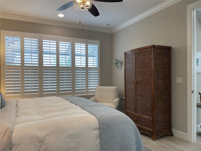 bedroom featuring ceiling fan, light hardwood / wood-style floors, and ornamental molding