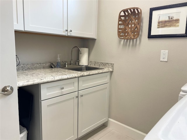 interior space featuring light tile patterned floors and sink