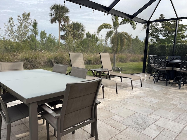 view of patio featuring a lanai