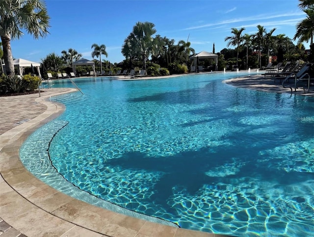 view of swimming pool featuring a gazebo