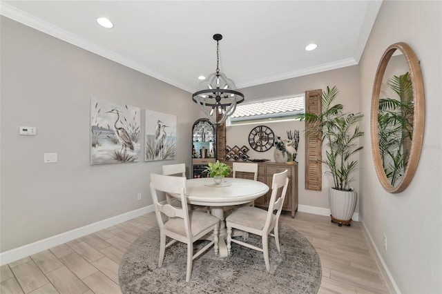 dining space featuring crown molding, a notable chandelier, and light wood-type flooring