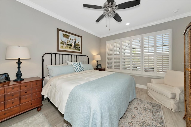 bedroom featuring crown molding, ceiling fan, and light hardwood / wood-style floors