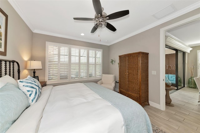 bedroom with crown molding, ceiling fan, and light hardwood / wood-style floors