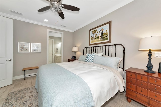 bedroom with crown molding, light hardwood / wood-style flooring, ceiling fan, and ensuite bathroom