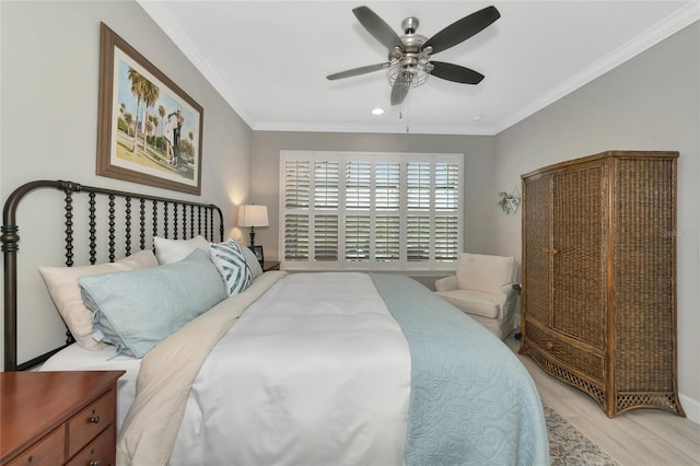 bedroom featuring light hardwood / wood-style flooring, ornamental molding, and ceiling fan