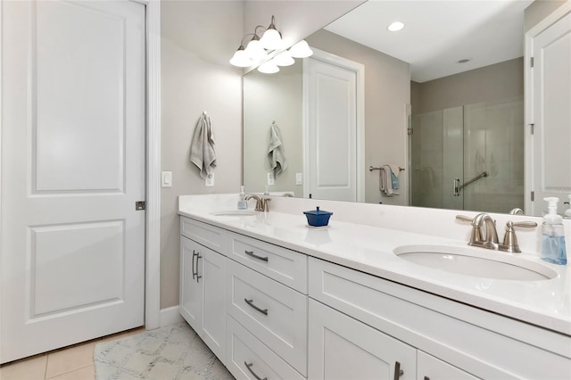 bathroom with vanity, tile patterned flooring, and a shower with door