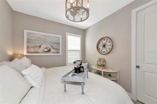 bedroom featuring a chandelier