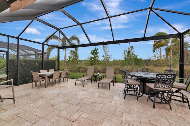 view of patio / terrace with a lanai