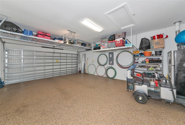 garage with stainless steel refrigerator