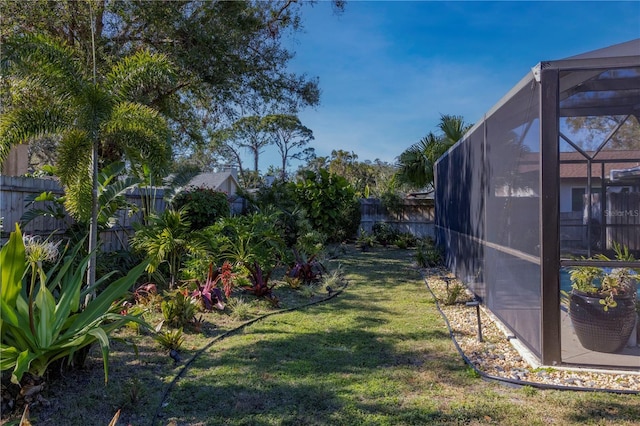 view of yard with a lanai