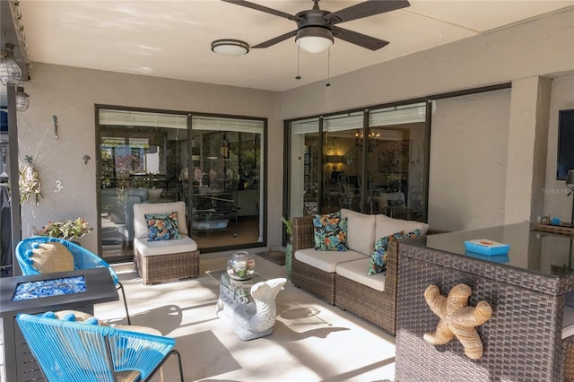 view of patio with ceiling fan and an outdoor living space