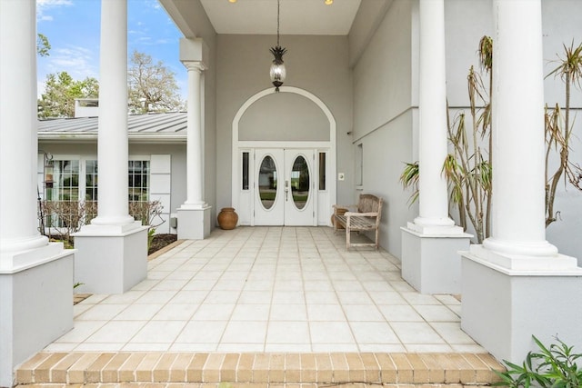 property entrance featuring french doors