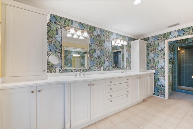 bathroom featuring vanity, crown molding, tile patterned floors, and a shower