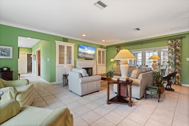 tiled living room with french doors and ornamental molding