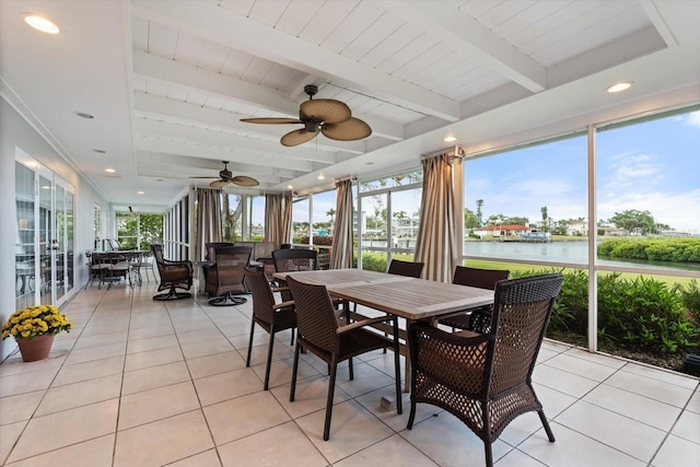 sunroom / solarium with a water view, wood ceiling, plenty of natural light, and beamed ceiling